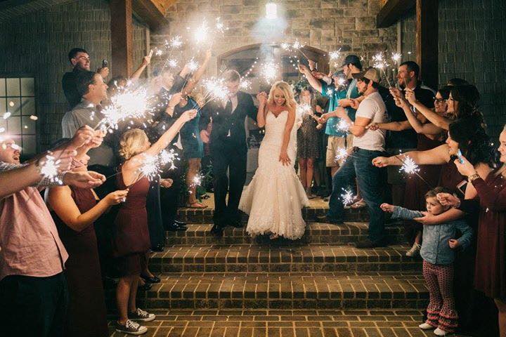 Bride and groom walking out of venue